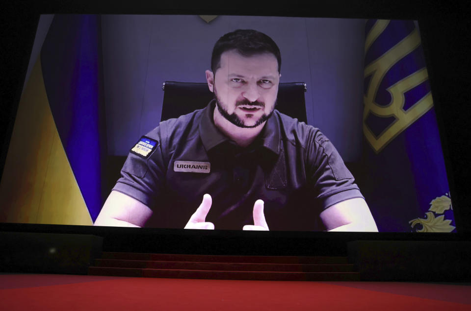 President of Ukraine Volodymyr Zelenskyy appears via remote during the opening ceremony of the 75th international film festival, Cannes, southern France, Tuesday, May 17, 2022. (Photo by Vianney Le Caer/Invision/AP)