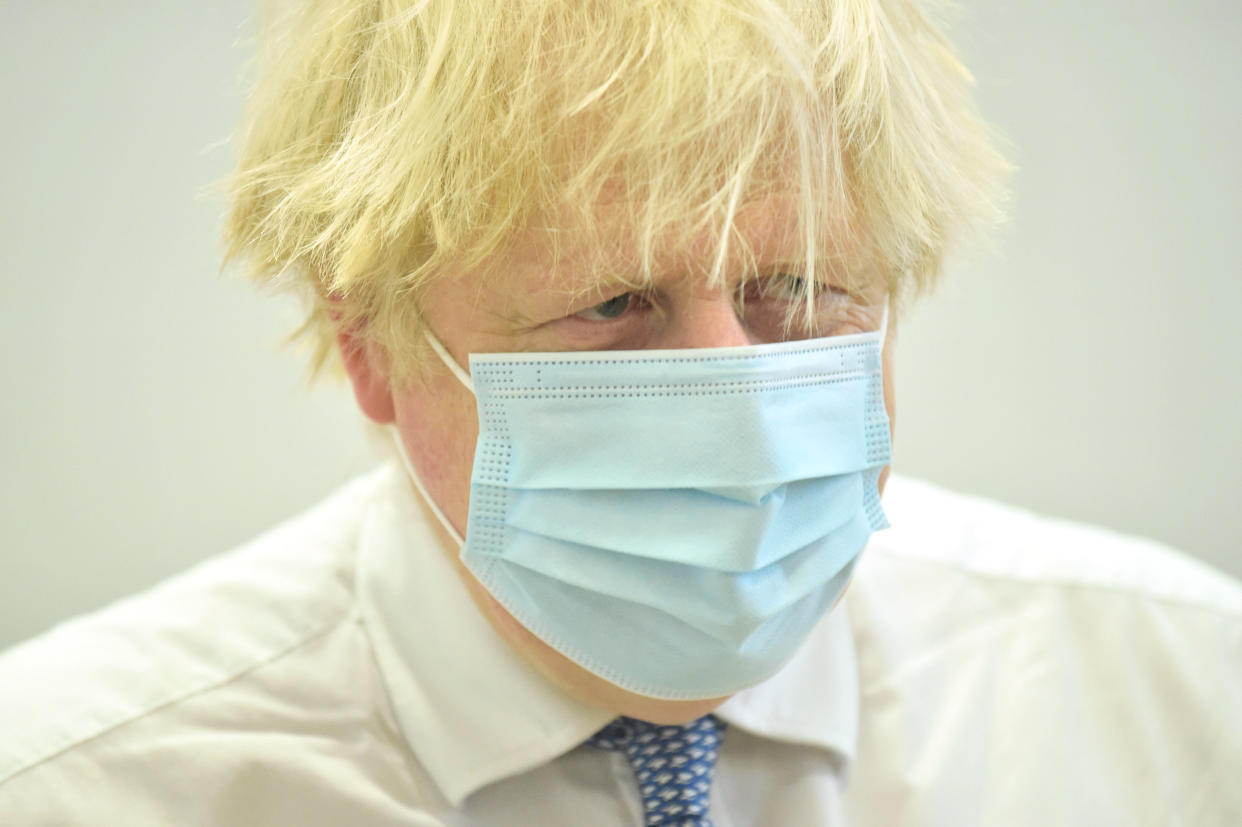 Prime Minister Boris Johnson during a visit to the Stow Health Vaccination centre in Westminster, central London. Picture date: Monday December 13, 2021.