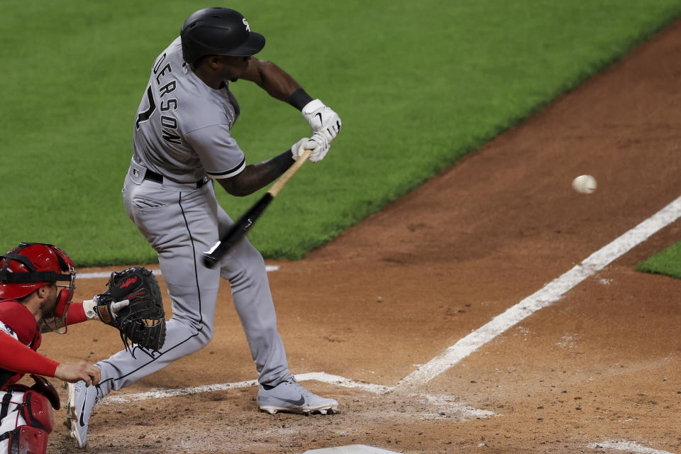 Chicago White Sox Tim Anderson hits an RBI single during the fourth inning of a baseball game against the Cincinnati Reds, Tuesday, May 4, 2021 in Cincinnati. (AP Photo/Aaron Doster)