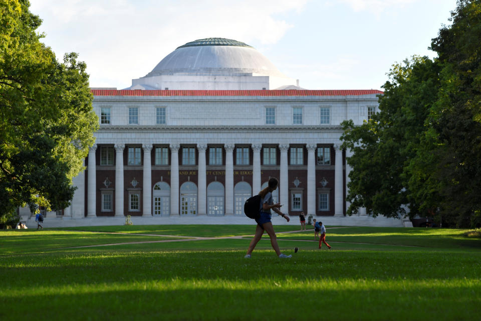 Students crossing the lawn in front of the Faye and Joe Wyatt Center for Education on the campus of Peabody College at Vanderbilt University in Nashville, Tennessee, U.S., September 18, 2018.  REUTERS/Harrison McClary