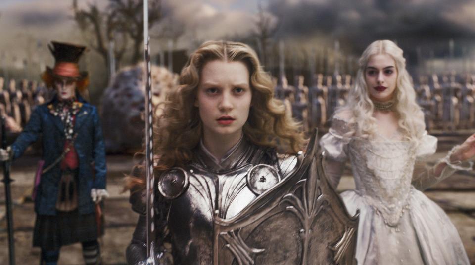 Young Alice (Mia Wasikowska, center) leads the troops, including Mad Hatter (Johnny Depp) and the White Queen (Anne Hathaway), in "Alice in Wonderland."