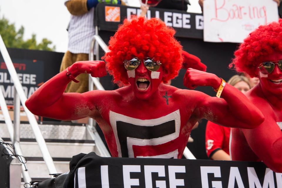 Paint line members cheer during ESPN’s College GameDay on Saturday, Oct. 2, 2021, at Myers Quad in Athens.