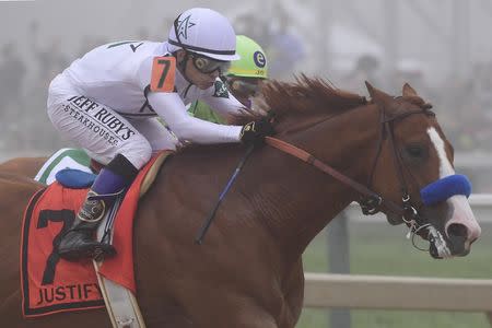 May 19, 2018; Baltimore, MD, USA; Mike Smith aboard Justify (7) passes Jose L. Ortiz aboard Good Magic (5) during the 143rd running of the Preakness Stakes at Pimlico Race Course. Mandatory Credit: Tommy Gilligan-USA TODAY Sports