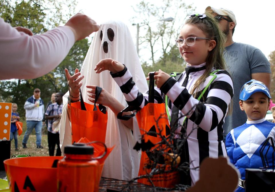 Kids get their candy at Trick or Treating in the Park in Goodlettsville in October 2022.