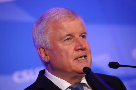 Leader of the Christian Social Union (CSU) Horst Seehofer reacts after first exit polls in the Bavarian state election in Munich, Germany, October 14, 2018. REUTERS/Michael Dalder