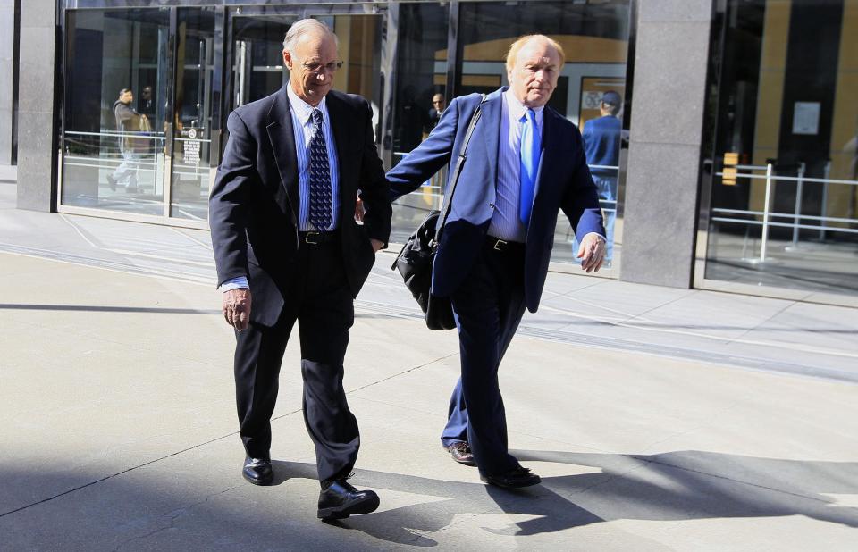 Robert Maegerle, left, walks out of a federal courthouse with attorney Jerome Froelich Jr. in San Francisco, Thursday, March 8, 2012. Maegerle, a retired DuPont engineered accused of working with Walter Liew to illegally sell DuPont’s techonology to a company controlled by the Chinese government, pleaded not guilty to economic espionage charges. (AP Photo/Jeff Chiu)