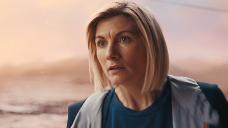 The thirteenth Doctor looks at a bunch of other Doctors in stunned silence.