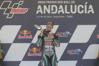 Yamaha rider Fabio Quartararo of France holds the trophy after winning the MotoGP race during the Andalucia Motorcycle Grand Prix at the Angel Nieto racetrack in Jerez de la Frontera, Spain, Sunday July 26, 2020. (AP Photo/David Clares)