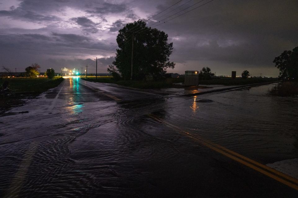 Water covers Carpenter Road at a low point on June 11, 2023, in Fort Collins. The segment of Carpenter between Greenstone Trail and Timberline Road was closed Sunday night.