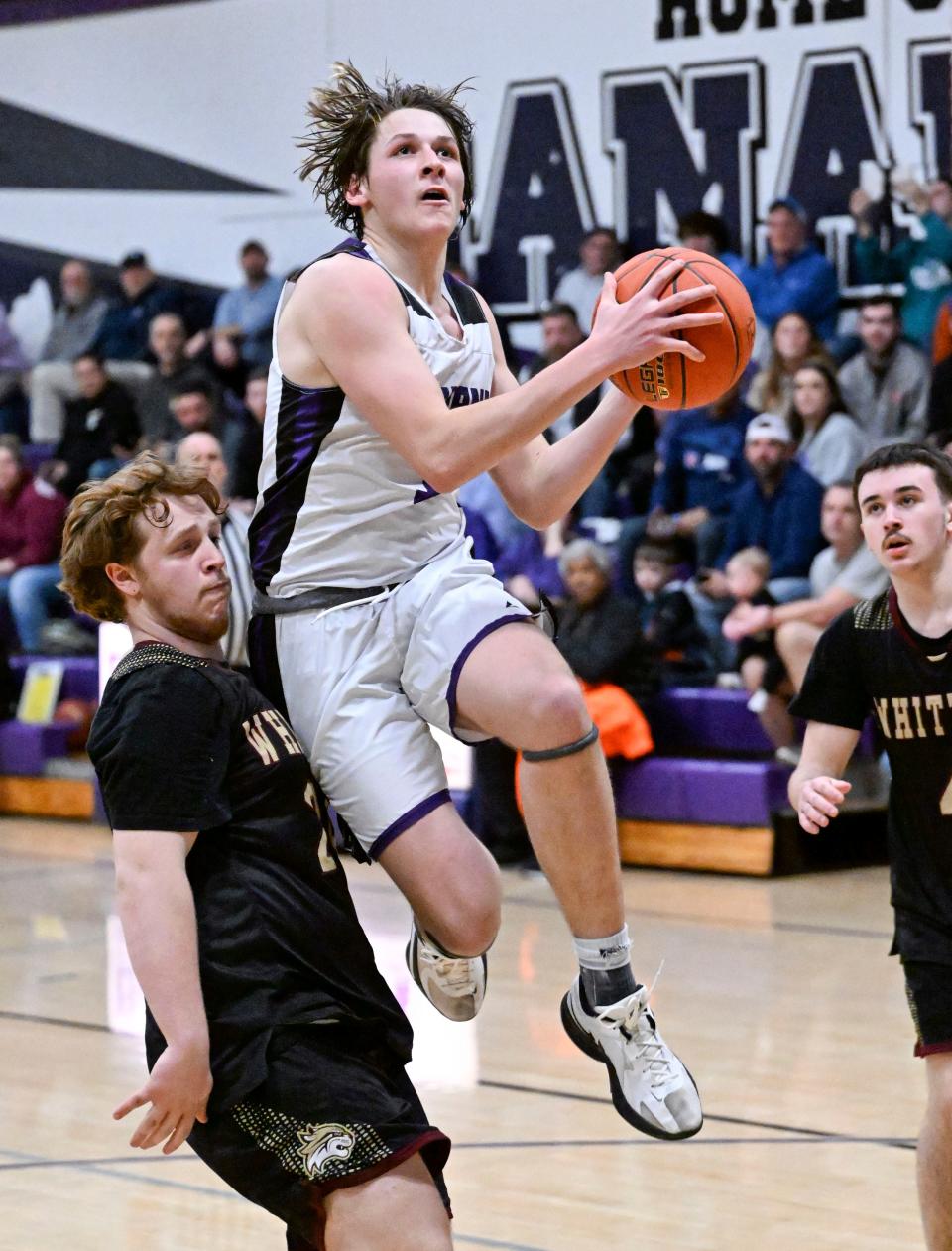 Shea Ullo of Bourne shoots glides to the hoop past Anthony Moro of Whittier RVT in Div. 4 Round of 32 basketball tournament
(Photo: Ron Schloerb/Cape Cod Times)