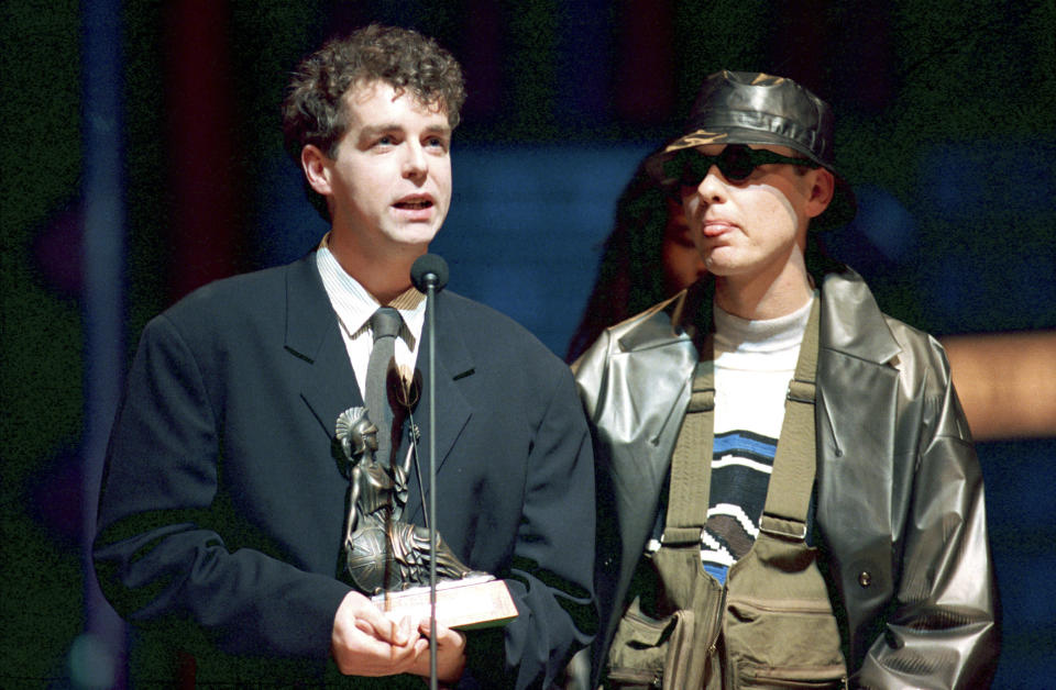 FILE - Chris Lowe, right, and Neil Tennant of the Pet Shop Boys accept their award at the British Industry Awards at the Royal Albert Hall in London, England, Monday evening, Feb. 8, 1988. Forty years and 50 million record sales after the Pet Shop Boys rose to fame with “West End Girls,” the iconic British duo is releasing a new album. “Nonetheless” is their 15th studio album. It arrives Friday, April 26, 2024. (AP Photo/Gill Allen, File)