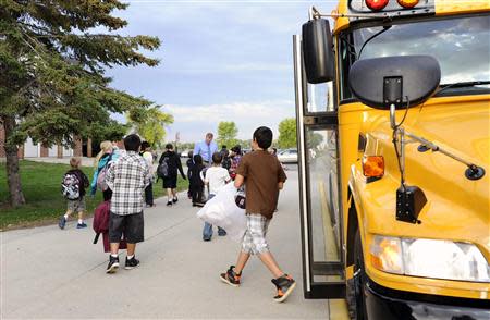 Students arrive for class at Mahnomen Elementary School in Mahnomen, Minnesota September 26, 2013. REUTERS/Dan Koeck