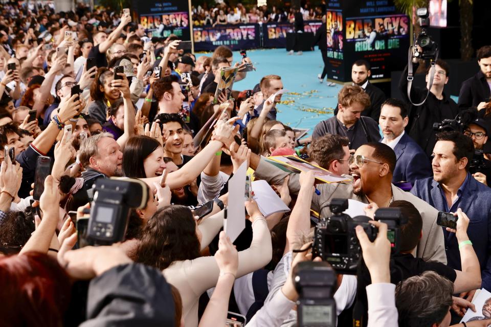 Actor Will Smith meets fans as he attends the European premiere of the film "Bad Boys: Ride or Die" at the Zoo Palast in Berlin, Monday May 27, 2024. (Carsten Koall/dpa via AP)