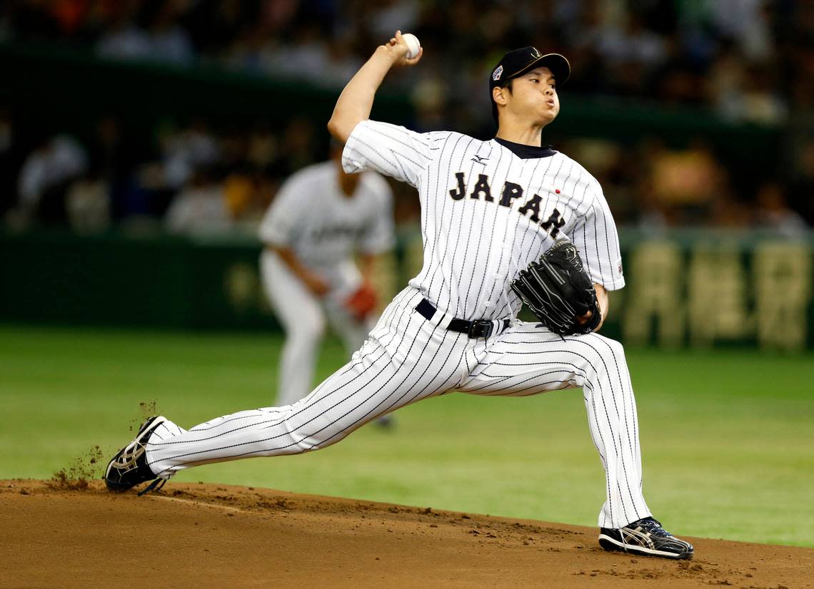 FILE - In this Nov. 19, 2015, file photo, Japan’s starter Shohei Otani pitches against South Korea during the first inning of their semifinal game at the Premier12 world baseball tournament at Tokyo Dome in Tokyo. A person familiar with the decision says Major League Baseball owners on Friday, Dec. 1, 2017, have approved a new posting agreement with their Japanese counterparts in a move that allows bidding to start for coveted pitcher and outfielder Shohei Ohtani. The person spoke on condition of anonymity because no announcement had been made. (AP Photo/Toru Takahashi, File)