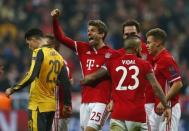 Football Soccer - Bayern Munich v Arsenal - UEFA Champions League Round of 16 First Leg - Allianz Arena, Munich, Germany - 15/2/17 Bayern Munich's Thomas Muller celebrates scoring their fifth goal with teammates Reuters / Michaela Rehle Livepic