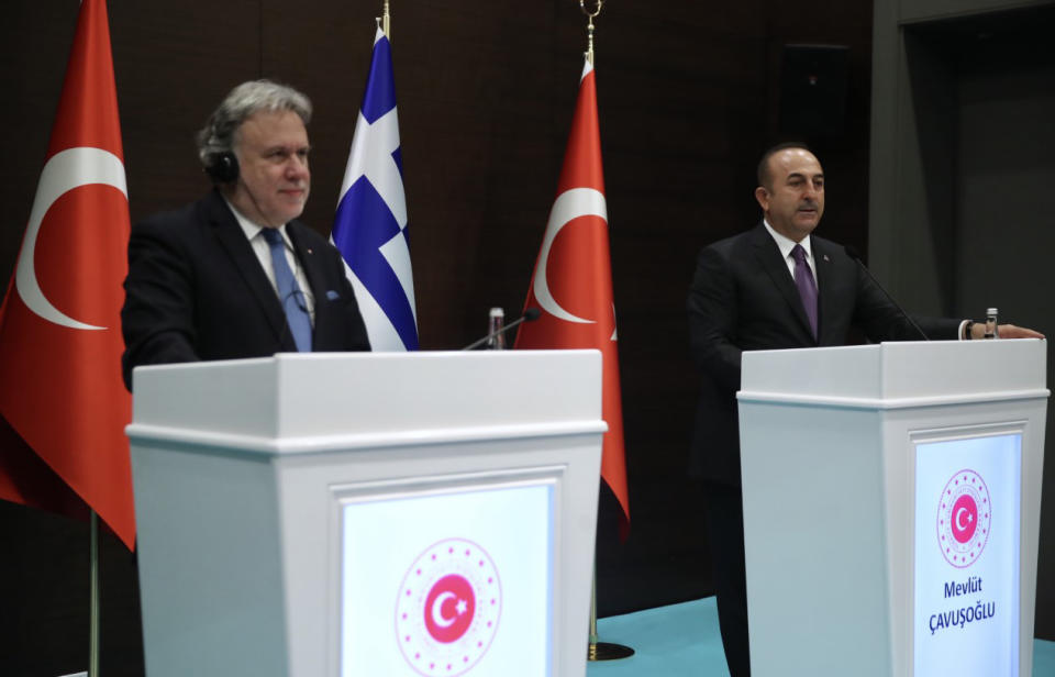 Turkey's Foreign Minister Mevlut Cavusoglu, right, and his Greek counterpart Giorgos Katrougalos speak to the media after their talks in the Mediterranean coastal city of Antalya, Turkey, Thursday, March 21, 2019. Cavusogly says the defense chiefs of Turkey and Greece could meet soon as part of new confidence-building measures aimed at reducing tensions between the NATO allies. (Turkish Foreign Ministry via AP, Pool)