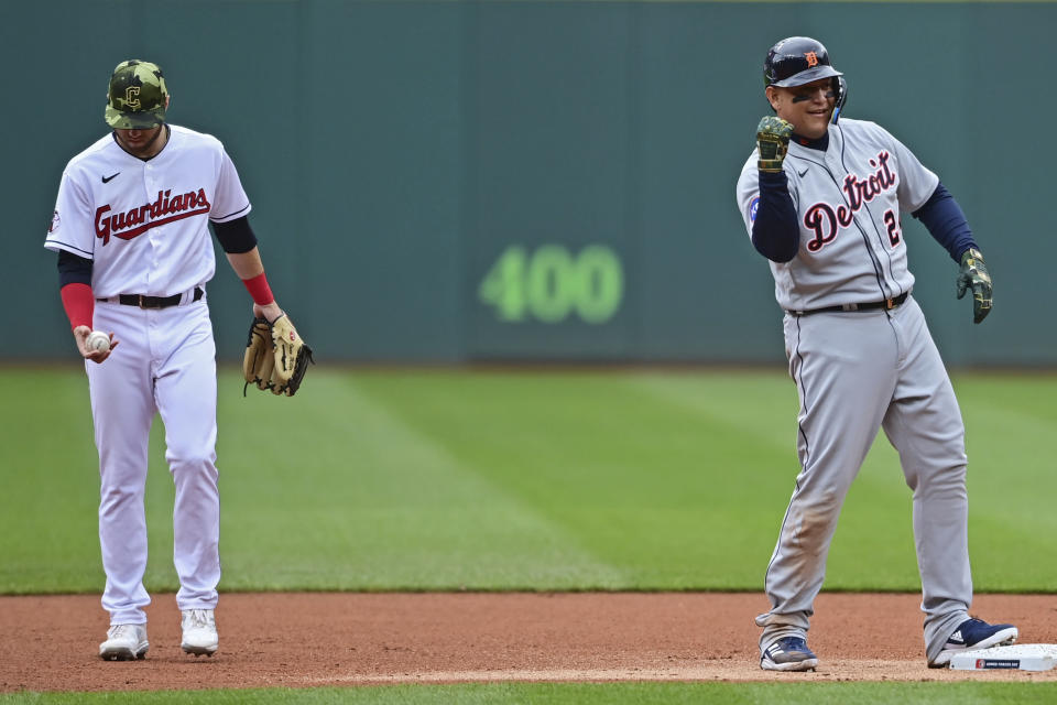 Detroit Tigers' Miguel Cabrera celebrates after hitting an RBI-double in the first inning of a baseball game against the Cleveland Guardians, Sunday, May 22, 2022, in Cleveland. Tigers' Robbie Grossman scored on the play. (AP Photo/David Dermer)