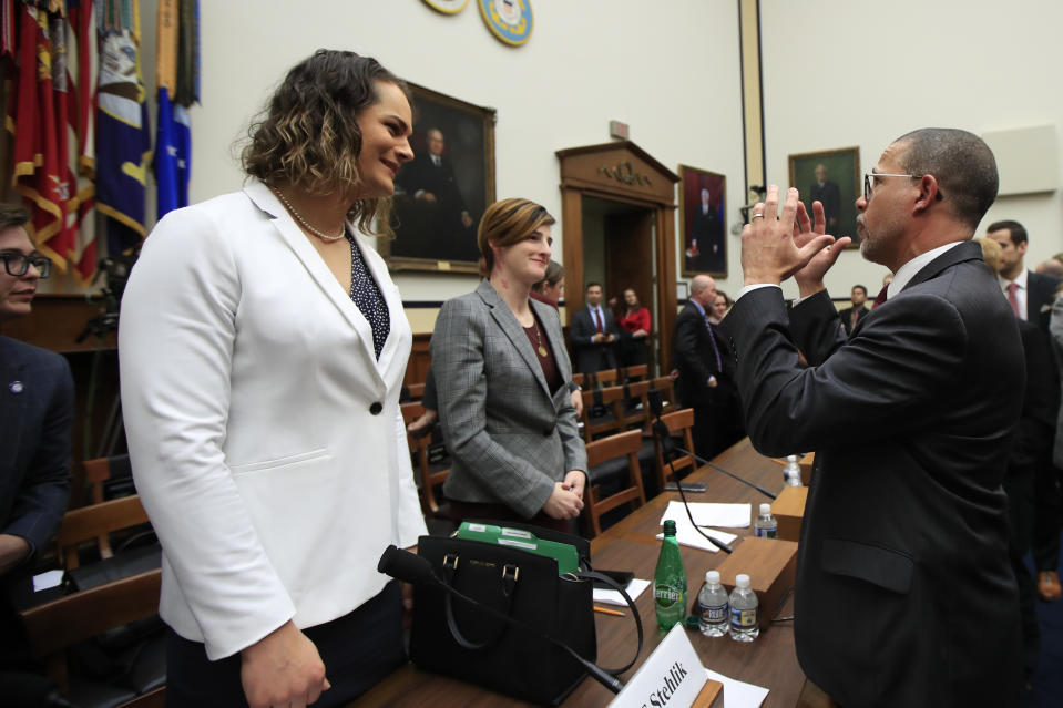 Rep. Anthony Brown, D-Md., talks to transgender military members Army Capt. Alivia Stehlik, from left, and Army Capt. Jennifer Peace, at the conclusion of a House Armed Services Subcommittee on Military Personnel hearing on Capitol Hill in Washington, Wednesday, Feb. 27, 2019. This is the first ever hearing that transgender military members openly testified in Congress. (AP Photo/Manuel Balce Ceneta)