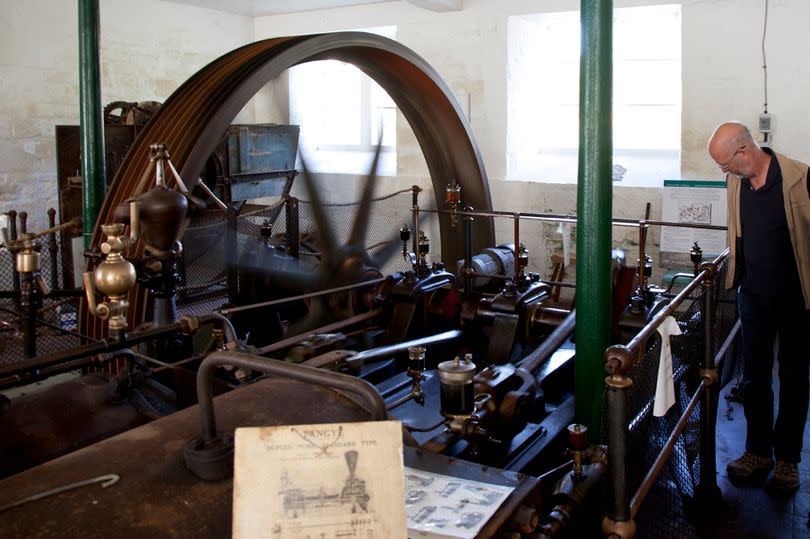 Vistors at the open day of a working Tangye steam driven machinery at the old 1820 textile mill of St Marys in Stroud