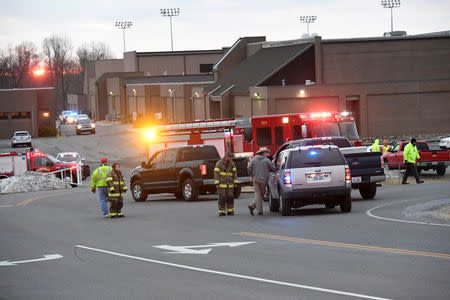 FILE PHOTO - Police investigators are seen at the scene of a shooting at Marshall County High School in Benton, Kentucky, U.S., January 23, 2018. REUTERS/Harrison McClary