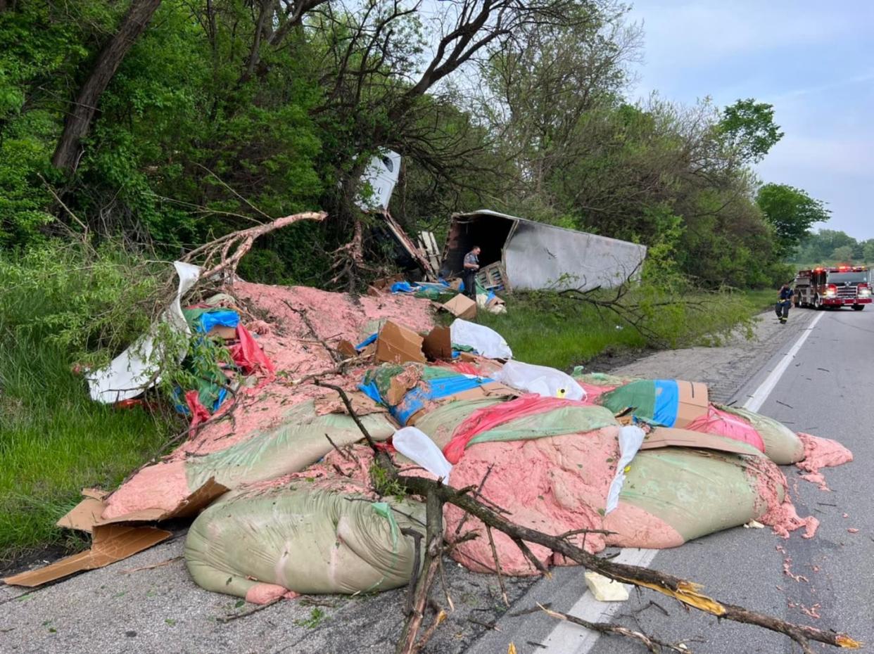 A tractor-trailer hauling meat products left the roadway and overturned.