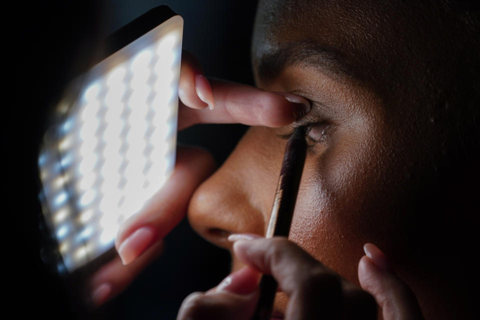 A model has her makeup done before the Christian Siriano collection is modeled during Fashion Week, Friday, Sept. 8, 2023, in New York. (AP Photo/Mary Altaffer)