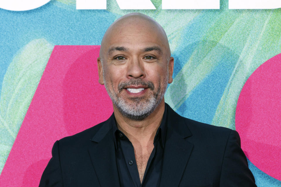 FILE - Jo Koy arrives at the World Premiere of "Easter Sunday" on Tuesday, Aug. 2, 2022, at the TCL Chinese Theatre in Los Angeles. Koy has been tapped to be the host for the Golden Globes, picked by producers for his “infectious energy and relatable humor.” (Photo by Willy Sanjuan/Invision/AP, File)