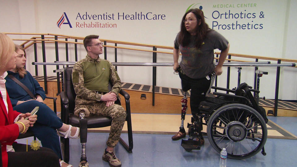 Alexander Chaika with Senator Tammy Duckworth, herself a wounded U.S. veteran.  / Credit: CBS News