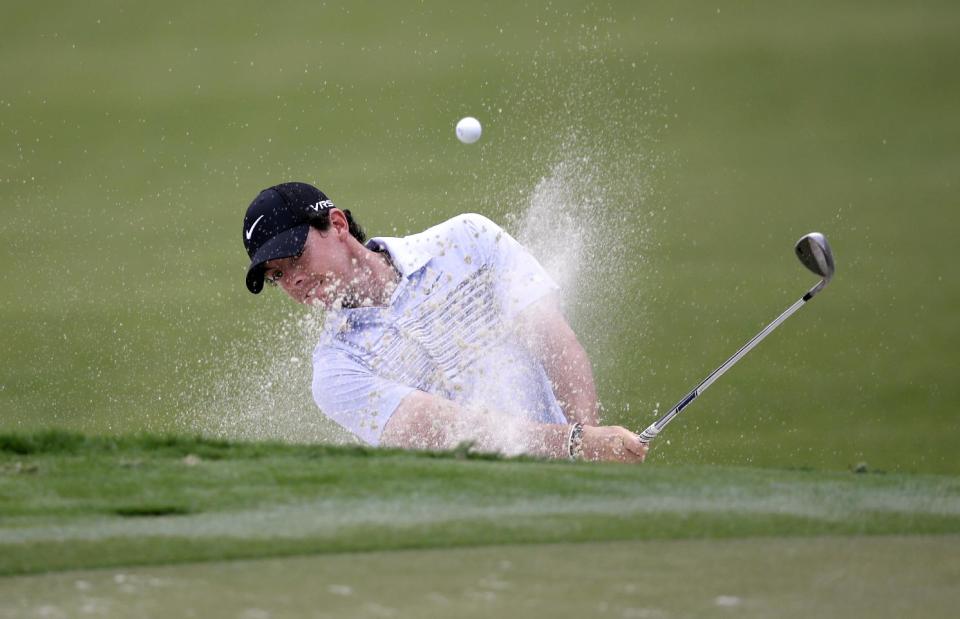 Rory McIlroy of Northern Ireland, hits from a 12th hole sand trap during the first round of the Cadillac Championship golf tournament Thursday, March 6, 2014, in Doral, Fla. (AP Photo/Wilfredo Lee)