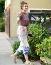 <p>Paris Jackson flashes a sign on Thursday while heading to a studio in Los Angeles.</p>