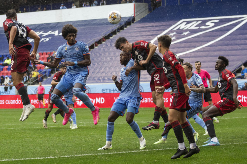 New York City FC's Andres Perea, center left, duels for the ball with Toronto FC's Alonso Coello, center right, during an MLS soccer match at Red Bull Arena, Sunday, Sept. 24, 2023, in Harrison, N.J. (AP Photo/Andres Kudacki)