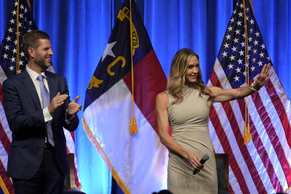 Lara Trump and her husband Eric Trump arrive at the North Carolina GOP convention in Greensboro, N.C., Friday, May 24, 2024. (AP Photo/Chuck Burton)