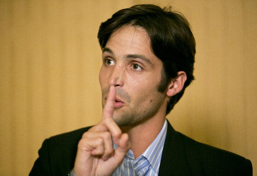 Plaintiff Michael Egan takes questions from to the media during a news conference in Beverly Hills, Calif., Thursday, April 17, 2014. A sex abuse lawsuit by Egan, a former child model and aspiring actor is accusing "X-Men" franchise director Bryan Singer of sexually abusing him as a teenager in a federal lawsuit filed in Hawaii. Singer's attorney, Marty Singer, said in a statement that the claims are absurd and defamatory. (AP Photo/Damian Dovarganes)