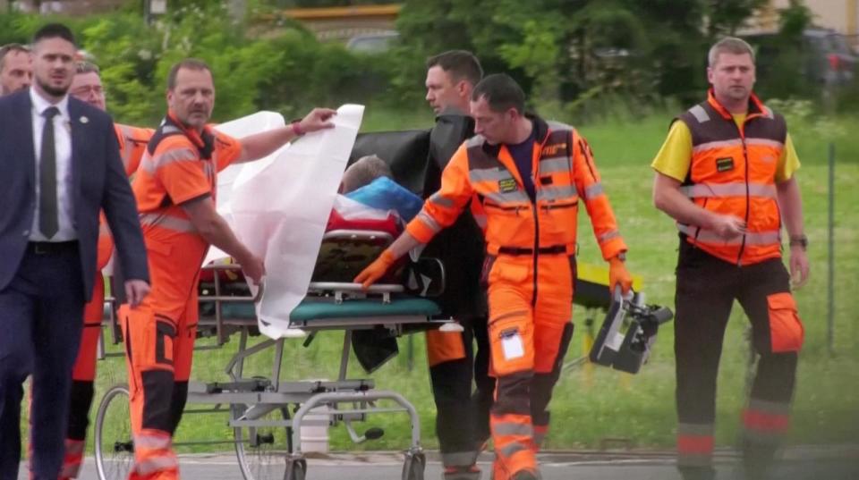 PHOTO: Medical personnel carry Slovakia's Prime Minister Robert Fico to hospital after being transported in a helicopter, in Banska Bystrica, Slovakia, May 15, 2024.  (JOJ TV/Handout via Reuters)