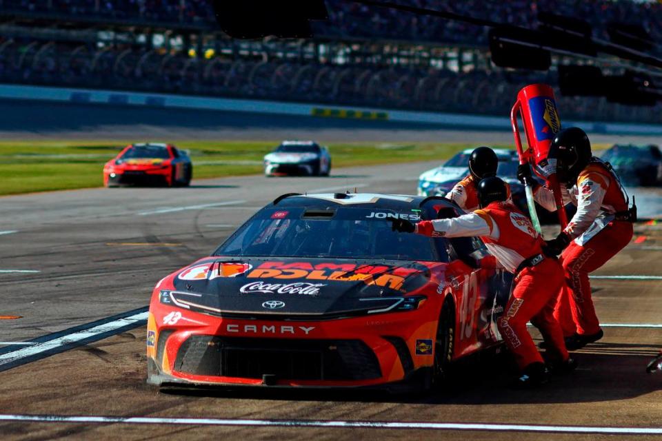 Apr 21, 2024; Talladega, Alabama, USA; NASCAR Cup Series driver Erik Jones (43) makes a pit stop during the GEICO 500 at Talladega Superspeedway.