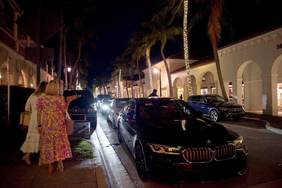 Cars are lined up at a valet station on Worth Avenue Thursday January 19, 2023 in Palm Beach. 