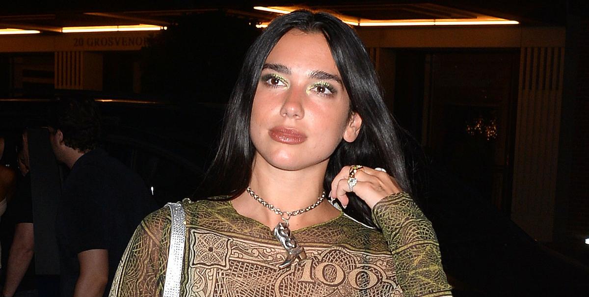 Dua Lipa Looks Rich in a Money-Print Top and Biker Shorts