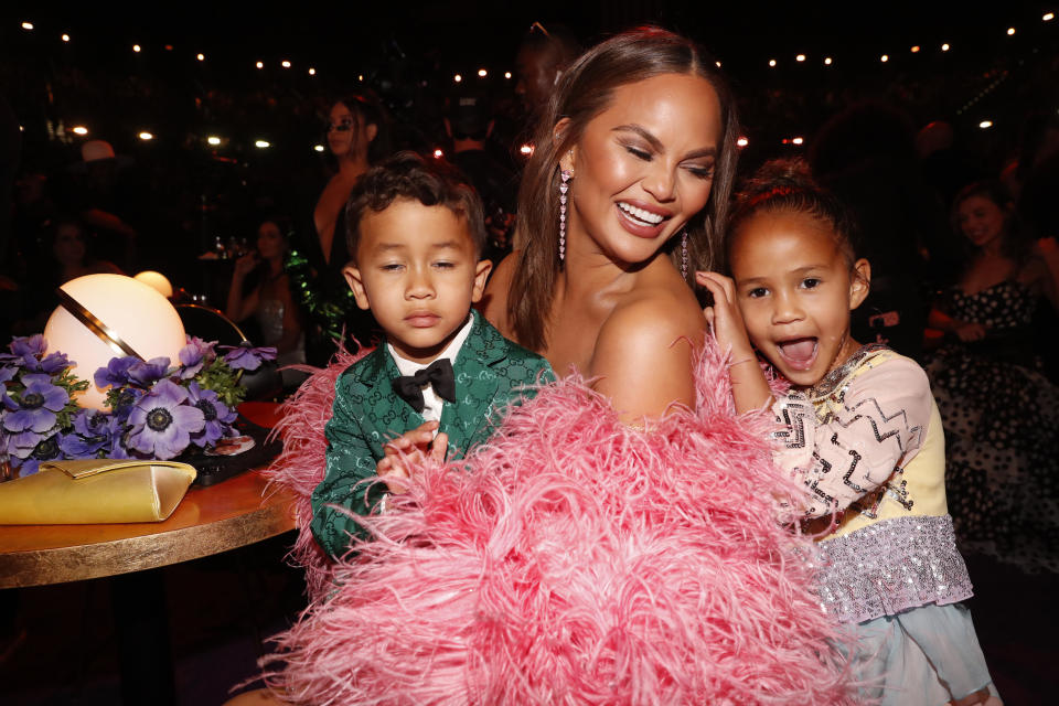LAS VEGAS, NEVADA - APRIL 03: (L-R) Miles Stephens, Chrissy Teigen, and Luna Stephens attend the 64th Annual GRAMMY Awards at MGM Grand Garden Arena on April 03, 2022 in Las Vegas, Nevada. (Photo by Johnny Nunez/Getty Images for The Recording Academy)