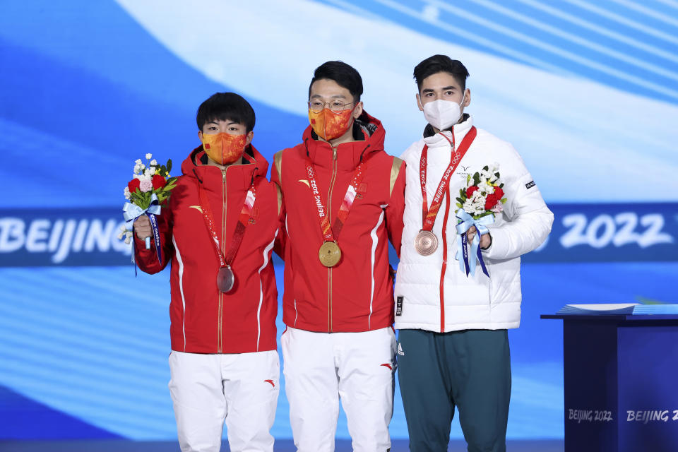 Ren Ziwei, pictured here with his gold medal at the Winter Olympics.