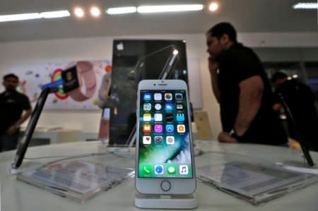 FILE PHOTO: An iPhone is seen on display at a kiosk at an Apple reseller store in Mumbai, India, January 12, 2017. REUTERS/Shailesh Andrade/File photo