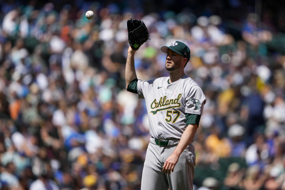 Oakland Athletics starting pitcher Alex Wood receives the ball after walking Seattle Mariners' Luis Urías during the second inning of a baseball game Sunday, May 12, 2024, in Seattle. (AP Photo/Lindsey Wasson)