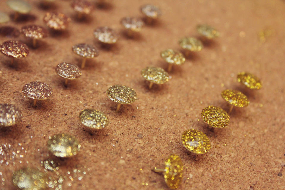 Turn <a href="http://www.huffingtonpost.com/2013/01/09/glitter-thumbtacks-craft_n_2434717.html?utm_hp_ref=craft-of-the-day">boring office supplies</a> into this.