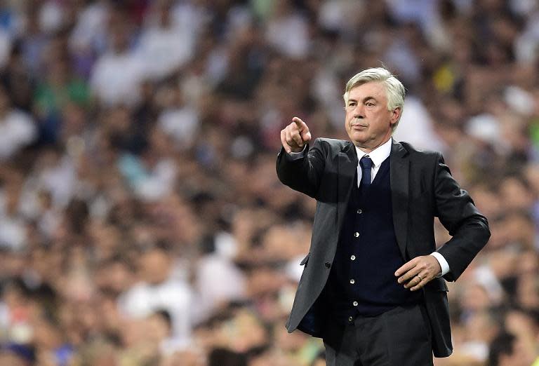 Real Madrid's Italian coach Carlo Ancelotti gestures during the UEFA Champions League semi-final second leg football match Real Madrid vs Juventus in Madrid on May 13, 2015