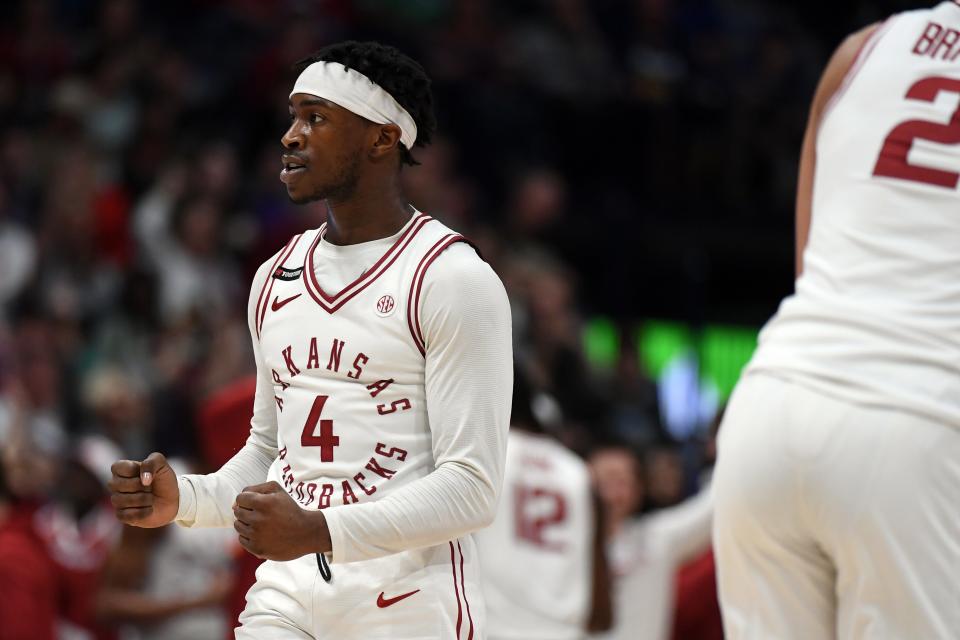 Mar 13, 2024; Nashville, TN, USA; Arkansas Razorbacks guard Davonte Davis (4) celebrates after a basket during the second half against the Vanderbilt Commodores at Bridgestone Arena. Mandatory Credit: Christopher Hanewinckel-USA TODAY Sports