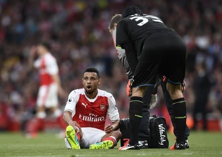 Britain Football Soccer - Arsenal v Chelsea - Premier League - Emirates Stadium - 24/9/16 Arsenal's Francis Coquelin receives medical attention after sustaining a injury Reuters / Dylan Martinez Livepic