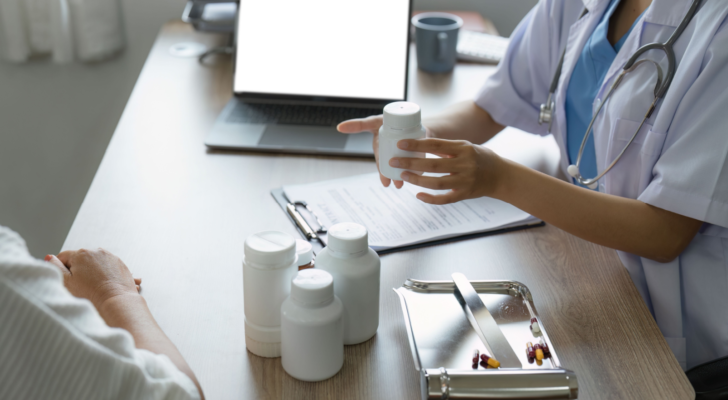 Doctor talking with elderly asian woman. Female primary care physician having conversation with older woman. Cano Health provides elderly healthcare