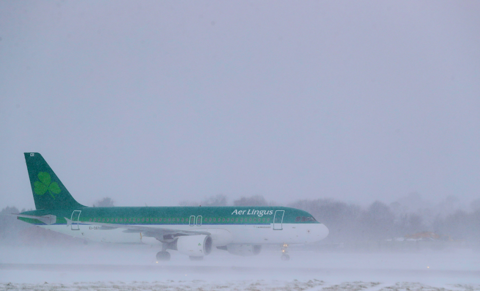 <em>An Aer Lingus plane after landing at Dublin airport, as heavy snow has caused more misery for travellers overnight (PA)</em>
