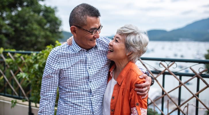 Retired couple enjoying time together outdoors.