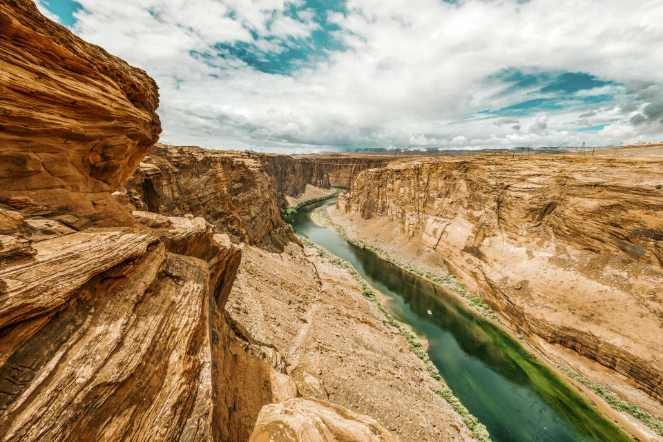 Dramatic landscape at the Grand Canyon National Park where the Colorado River runs through rock formations of eroded sand stone.