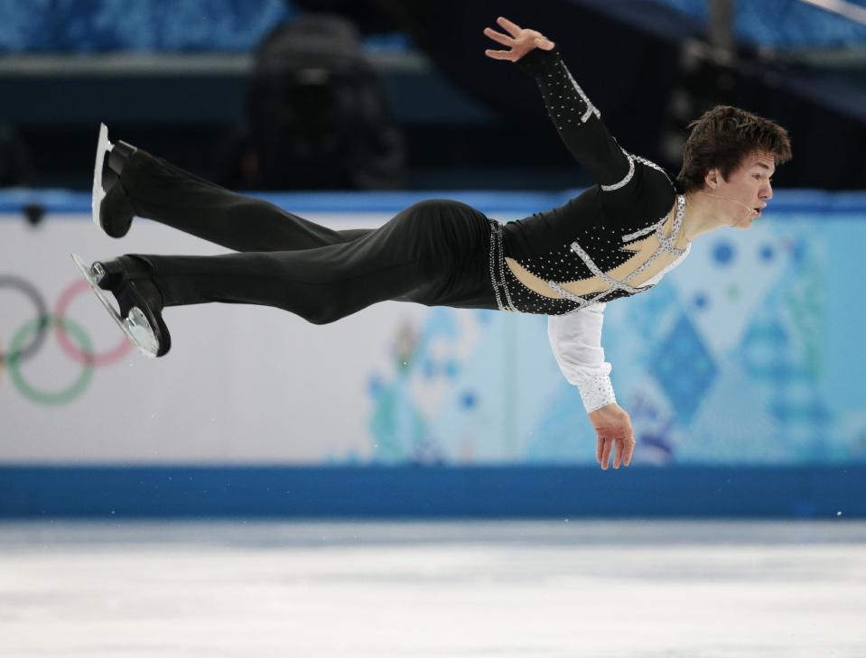 Yakov Godorozha of Ukraine competes in the men's short program figure skating competition at the Iceberg Skating Palace during the 2014 Winter Olympics, Thursday, Feb. 13, 2014, in Sochi, Russia. (AP Photo/Ivan Sekretarev)